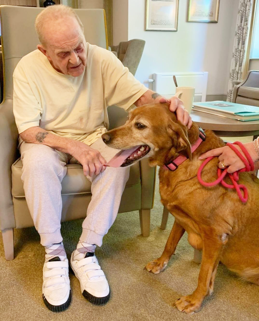 male resident petting dog