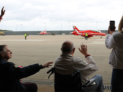 Waving the Red Arrows off, as they begin to leave for London